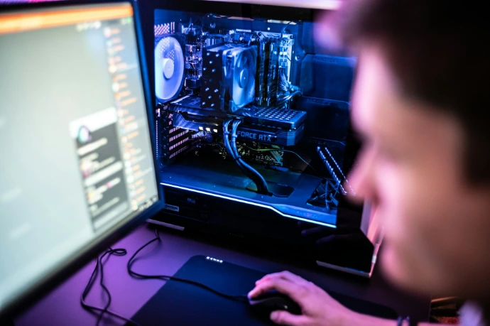 a man is looking at a computer screen